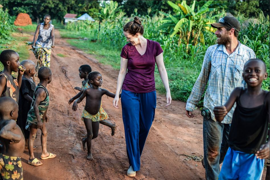 Sarah and Martin walking with children in South Sudan
