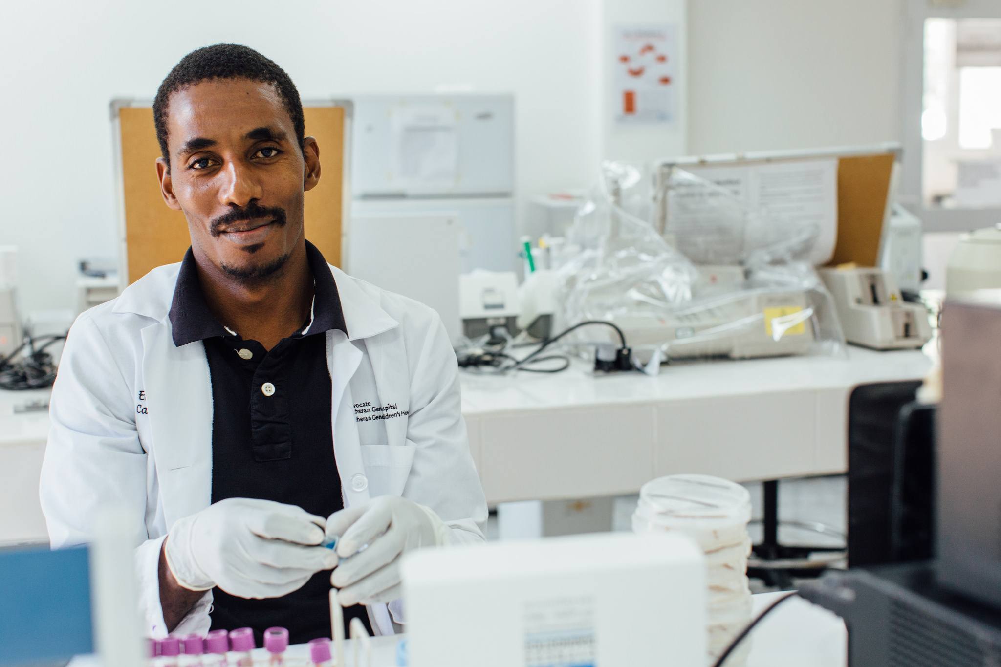 health worker in lab in haiti