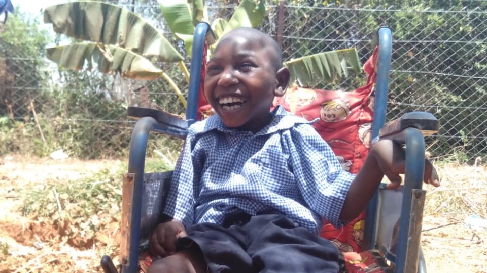 amos smiling in his wheelchair