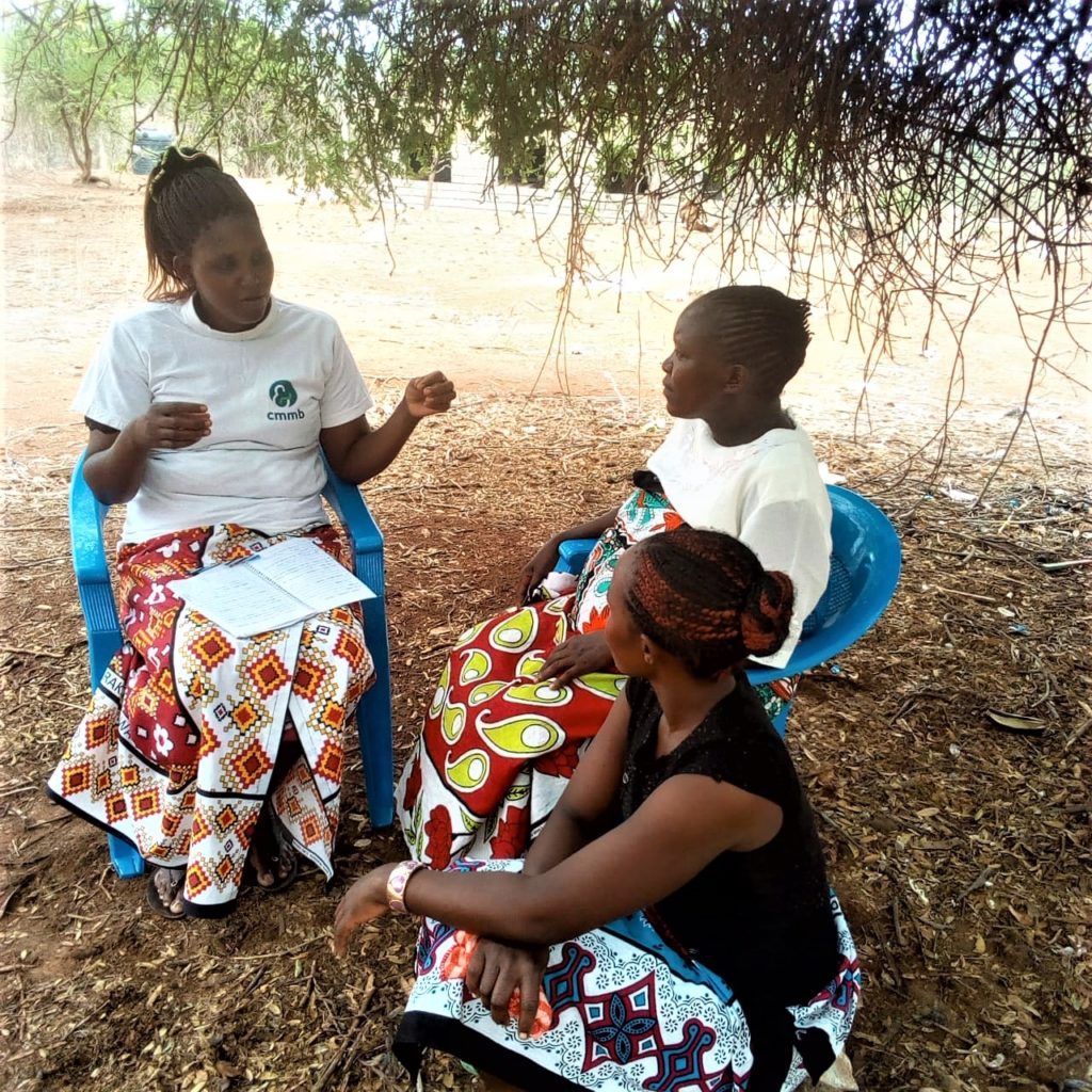 Elizabeth, a Community Health Volunteer working with local women in Kenya