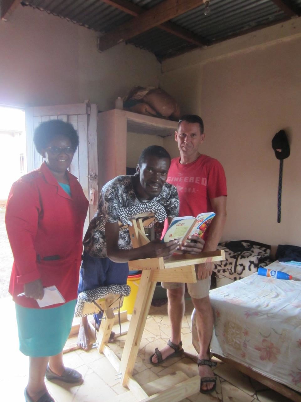 Khulani with the operation hope team and his new chair 