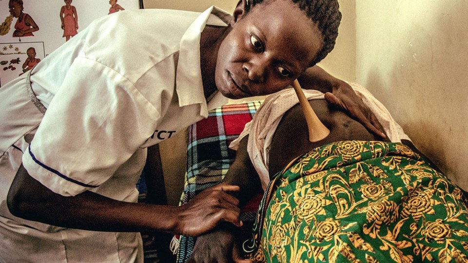 A nurse assessing a pregnant woman in South Sudan