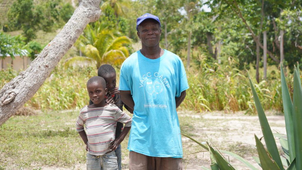 two children with their dad in Haiti 