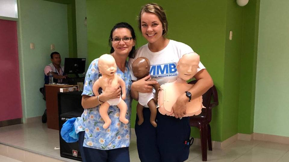 Andree with the ISHI team in Peru. They are holding dolls used in medical training sessions