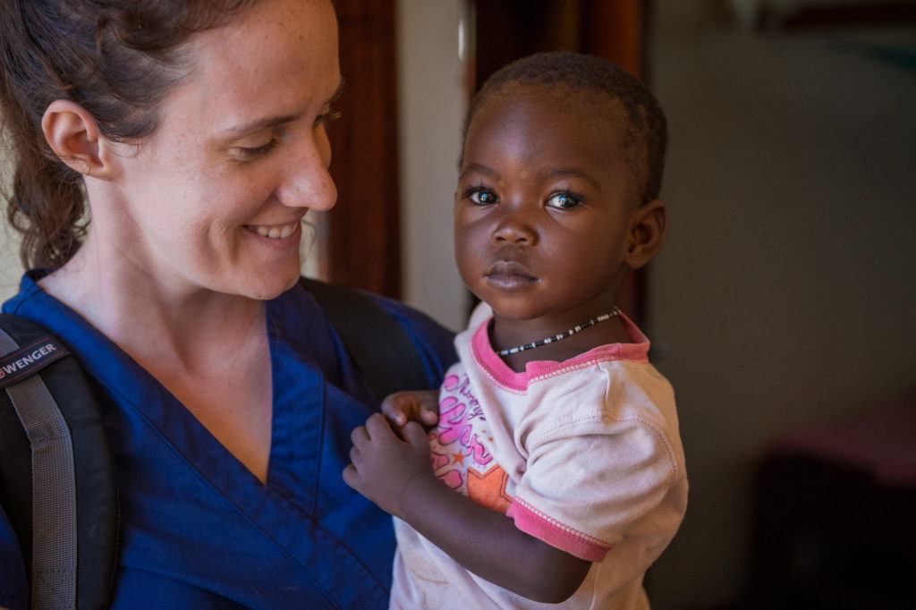 Sarah Rubino holding one of her young patients