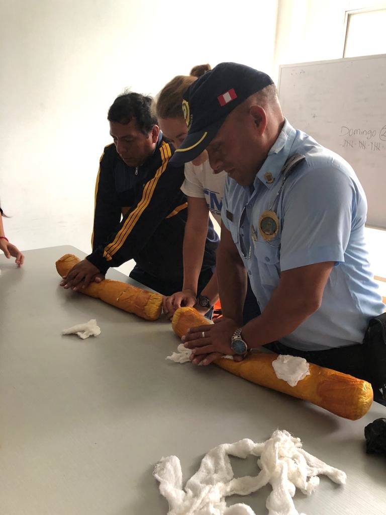 Police officers being trained in CPR in Peru 