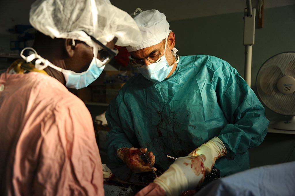 Dr. Tom performing surgery in the Nuba Mountains