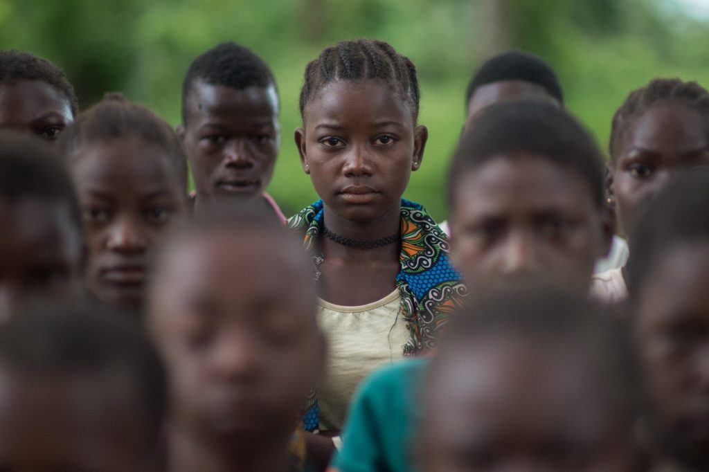 Former Child Soldiers in South Sudan stand next ton one another