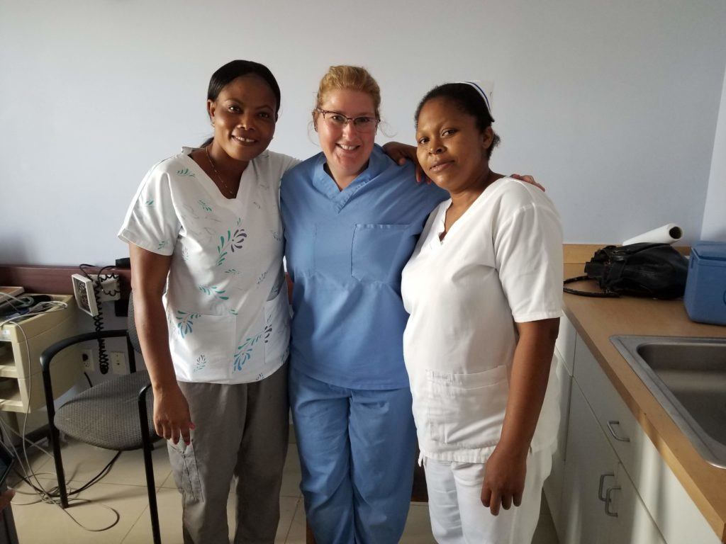 Tracy with two nurses in Haiti