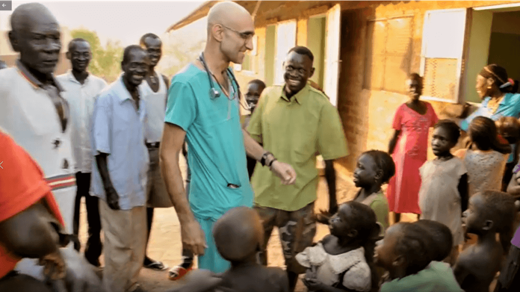 dr tom with kids in Sudan