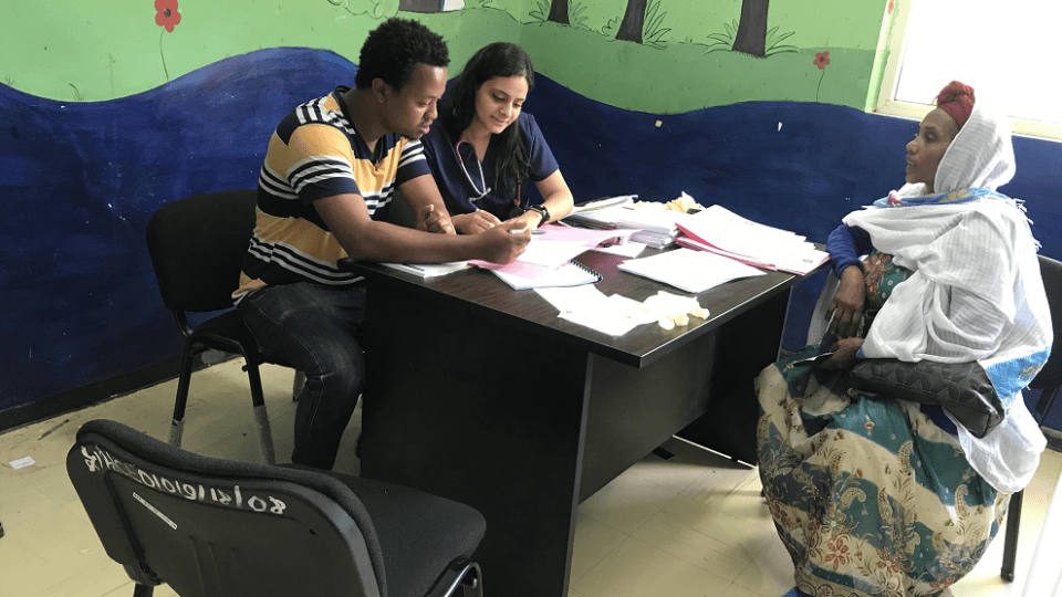 CMANA volunteers doing a consultation with an elderly patient