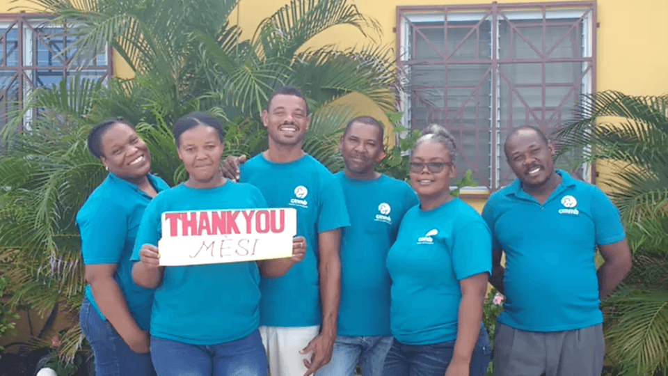 group with thank you sign