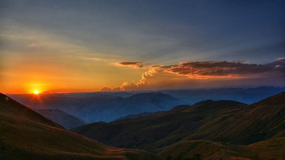 scenic photo of mountains at sunrise