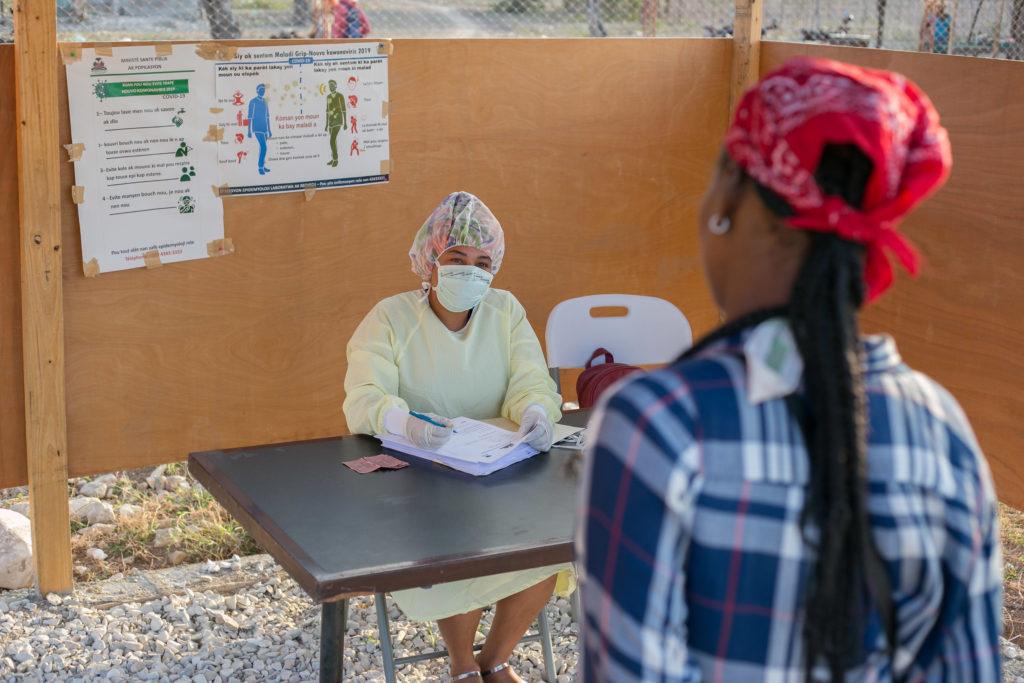 A screening center is set up outside the hospital in Haiti