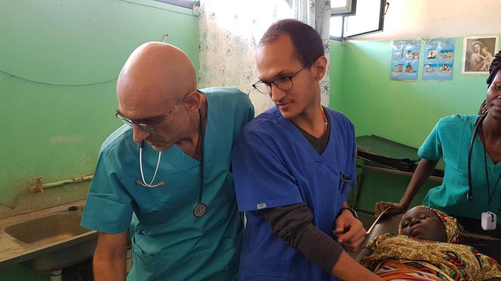 Dr. Tom and Dr. Jose serving a patient