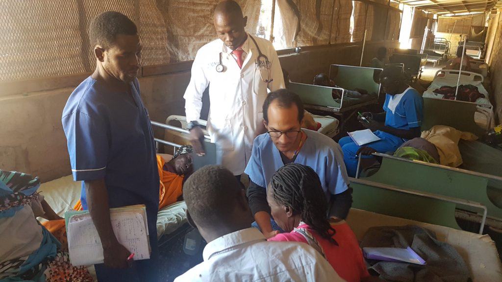 Dr. Jose serves a patient at the mother of mercy hospital in Sudan