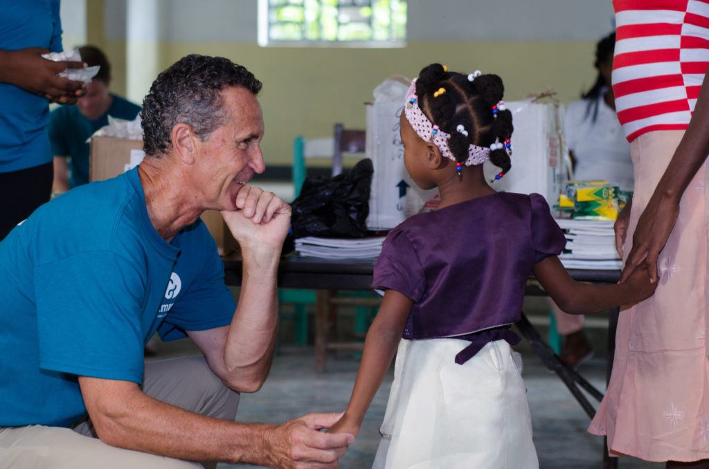 Bruce with a girl in Haiti 