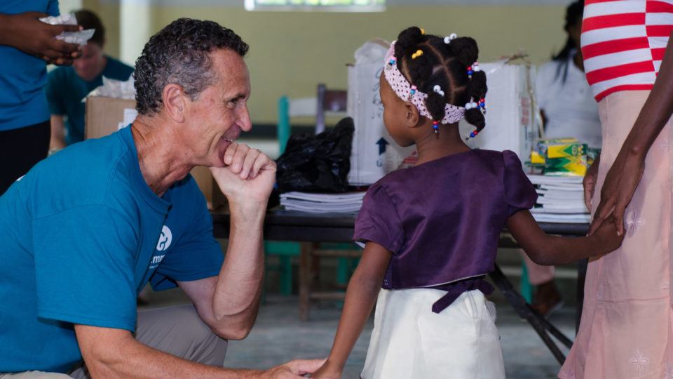 Bruce with a girl in Haiti