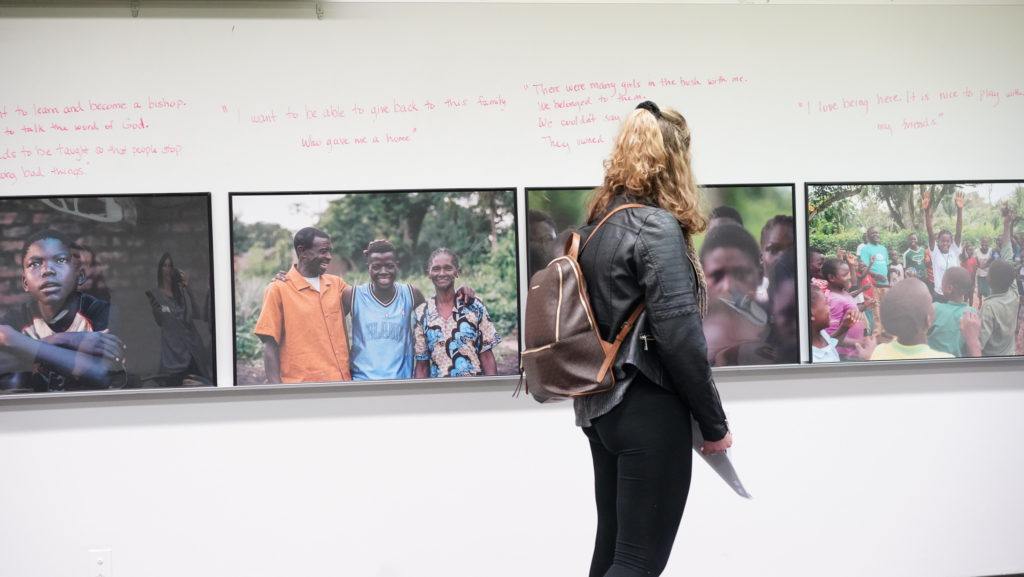 student looking at child soldier images