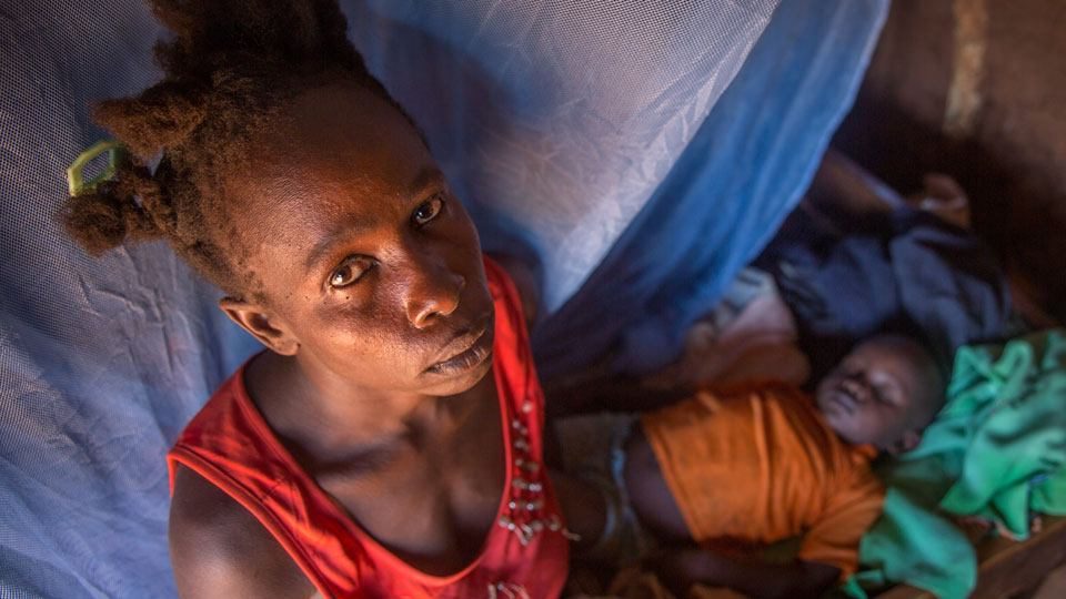 A mother with her sleep child in Mutomo, Kenya