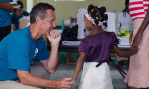 Bruce Wilkinson with Small Girl and Mother in Haiti