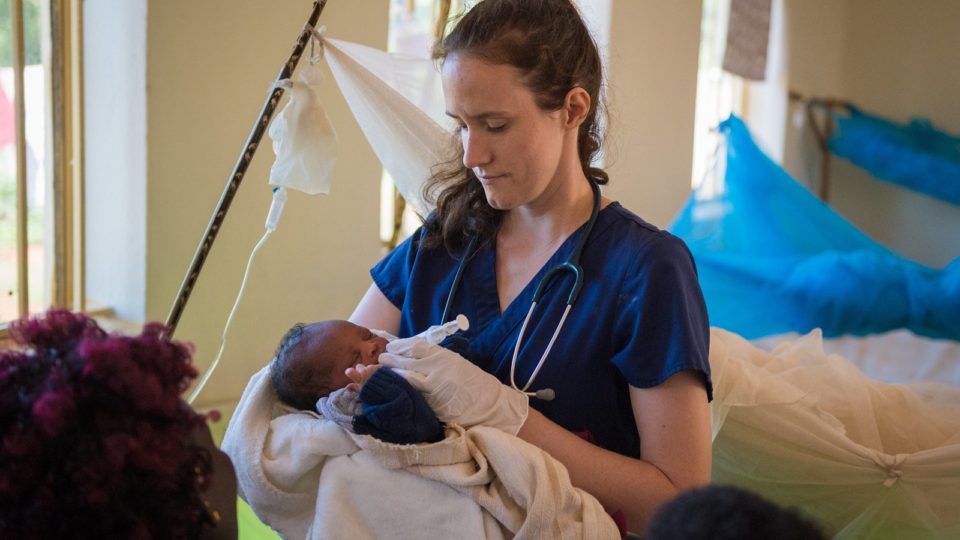 Volunteer Nurse Sarah Rubino holding child in South Sudan in October 2018.