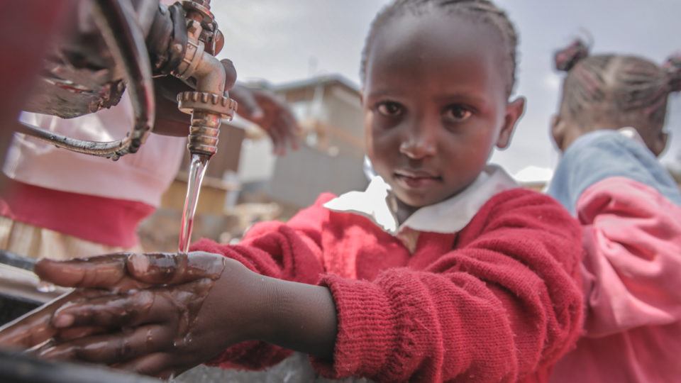 Young Child Washing Hands with Clean Water in Kenya in 2017