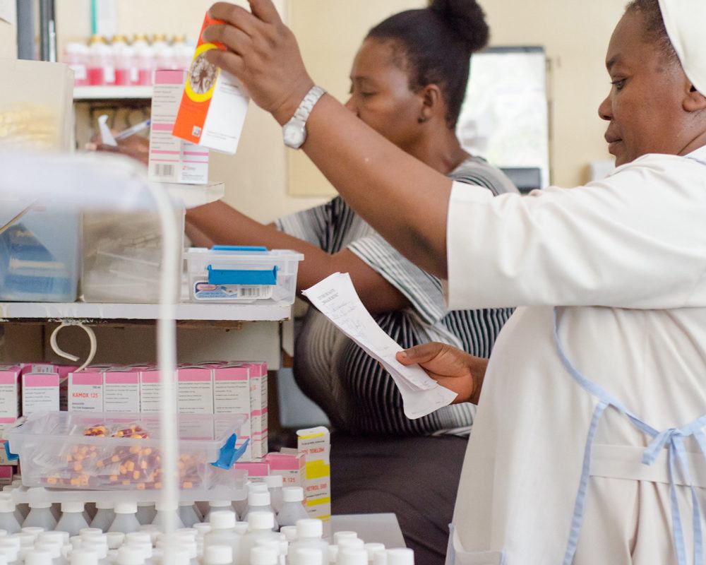 A pharmacy techinican with medical prodcut in Haiti in August 2019.
