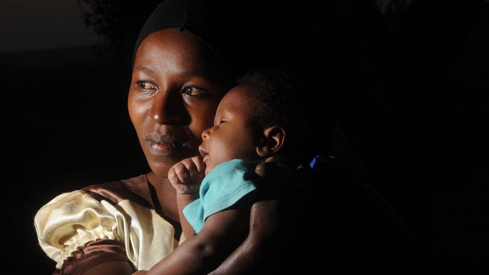 A mother and baby in Kenya in the darkness in June 2020.