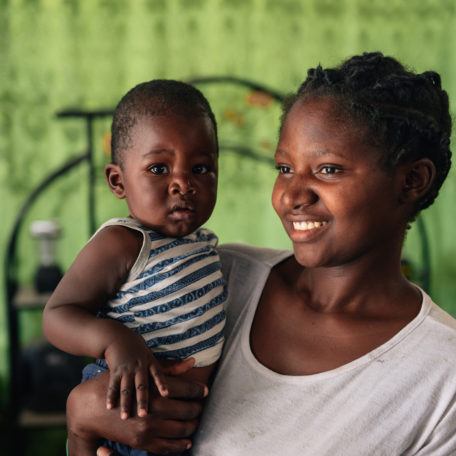 A mother holding her young child in Mwandi, Zambia in October 2019.