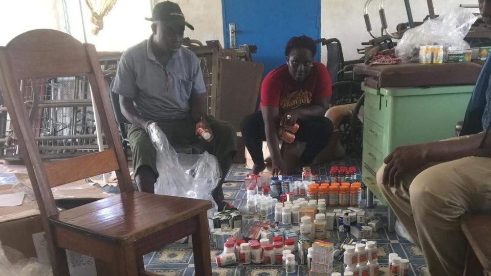 Volunteers sort through donated medicines in Liberia in March 2020