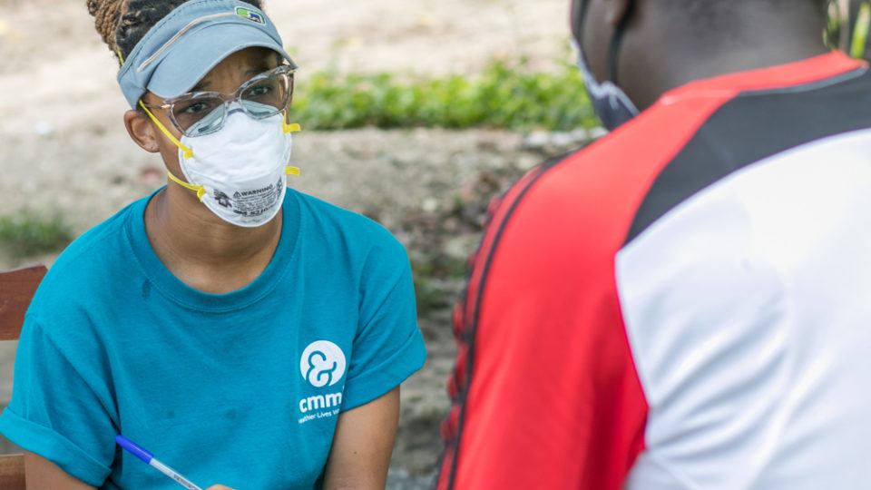 A comunity health worker in Haiti during COVID-19 response in July 2020.
