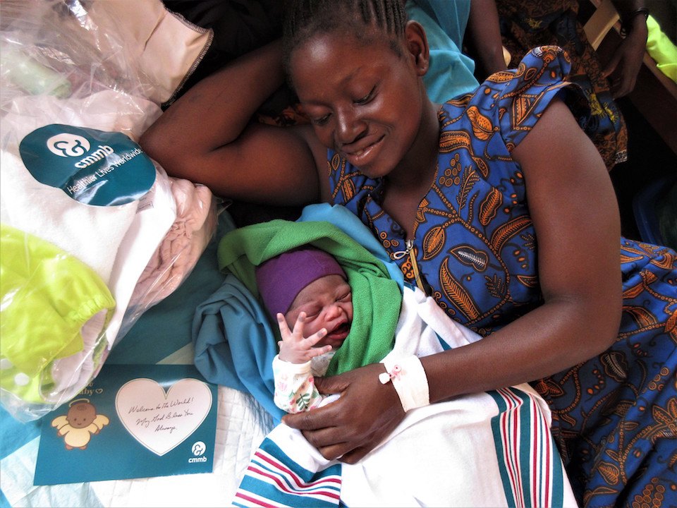A mother with CMMB newborn and delivery kits