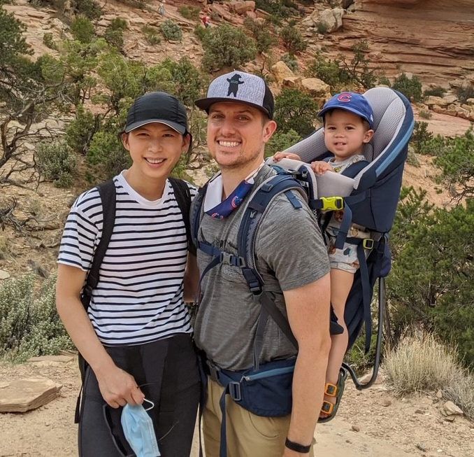 Lynn and Matt Styczynski with their son on a hike.