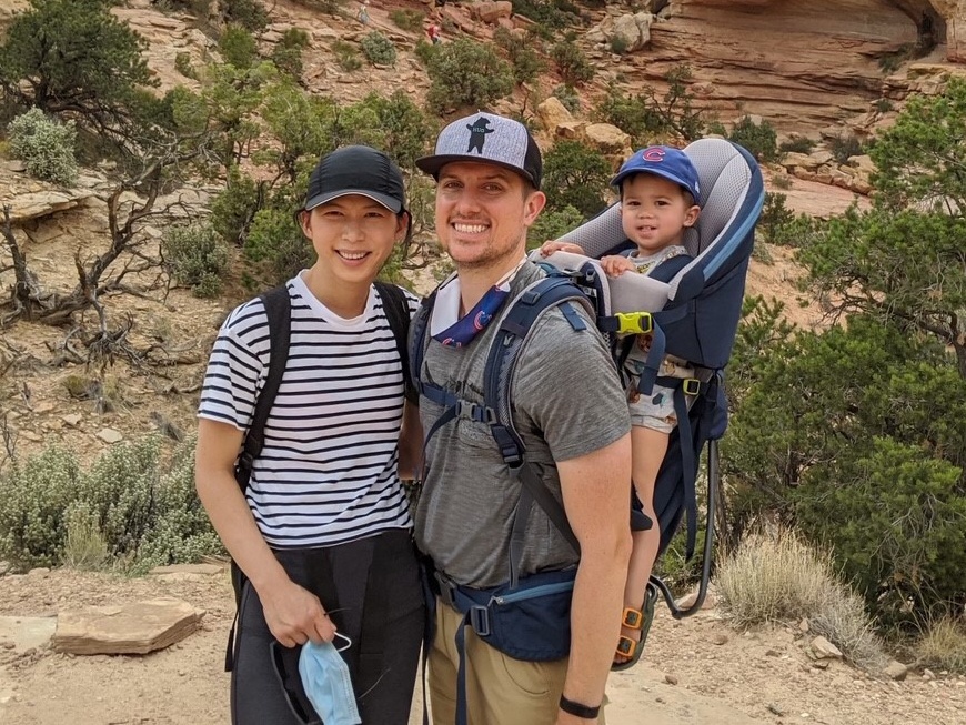 Lynn and Matt Styczynski with their son on a hike.