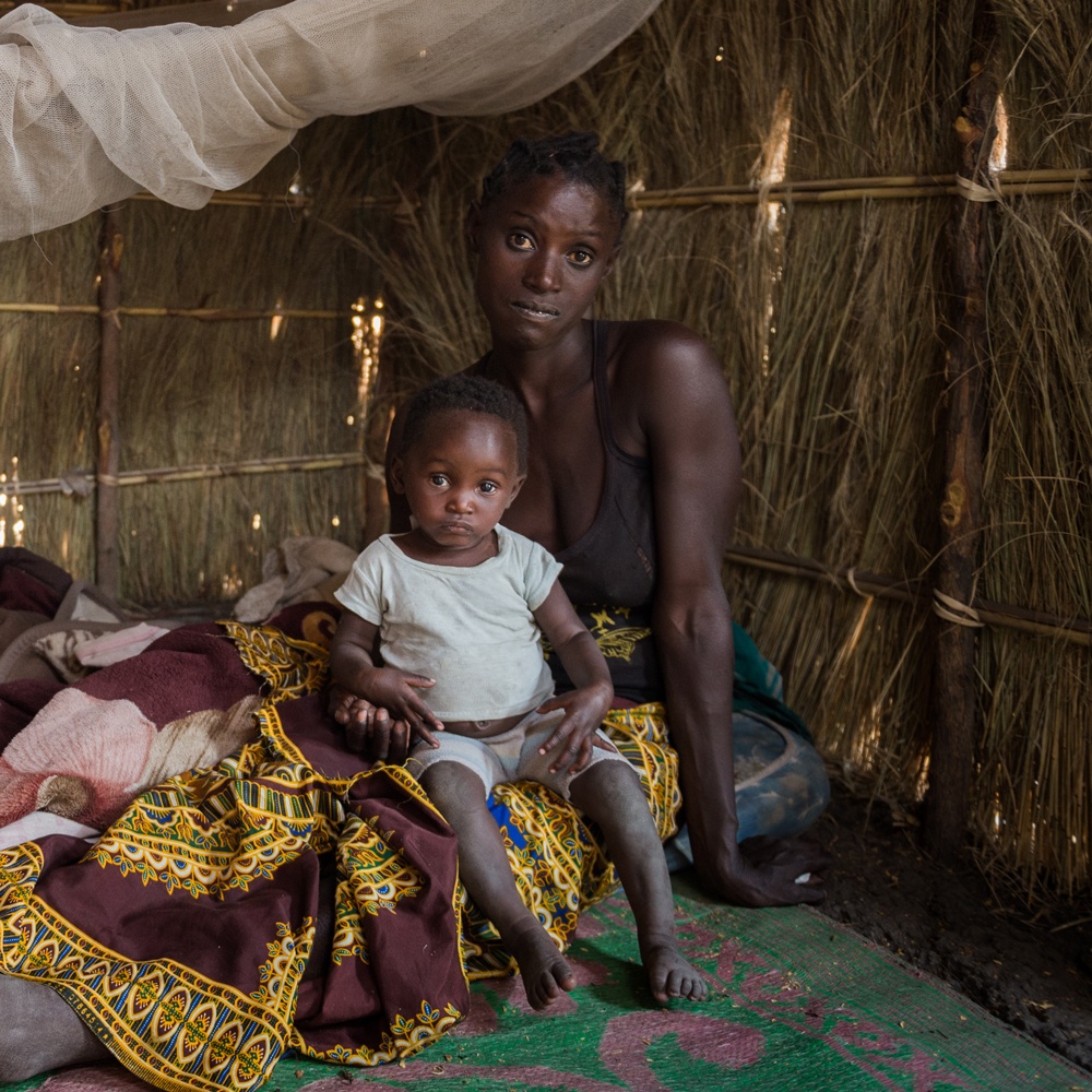 A mother with her child in her thatched home in Zambia in October 2019.
