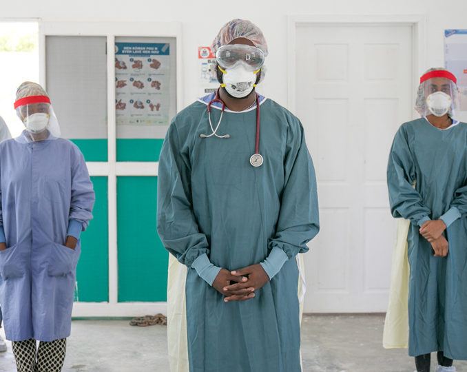 Community health workers dressed in PPE as part of CMMB's COVID-19 response in Haiti in July 2020.