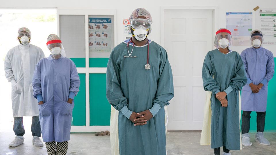 Community health workers dressed in PPE as part of CMMB's COVID-19 response in Haiti in July 2020.