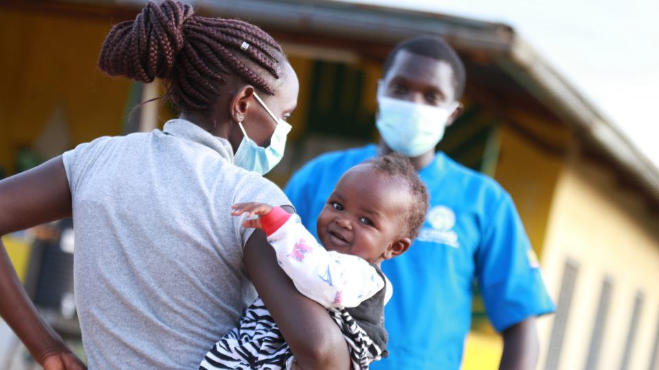 mom and child with community health worker