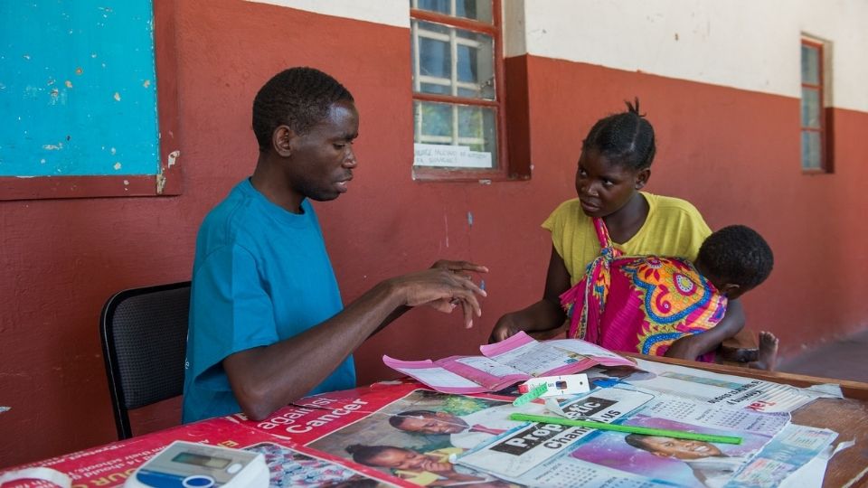 A mom receives support at a health facility in Zambia