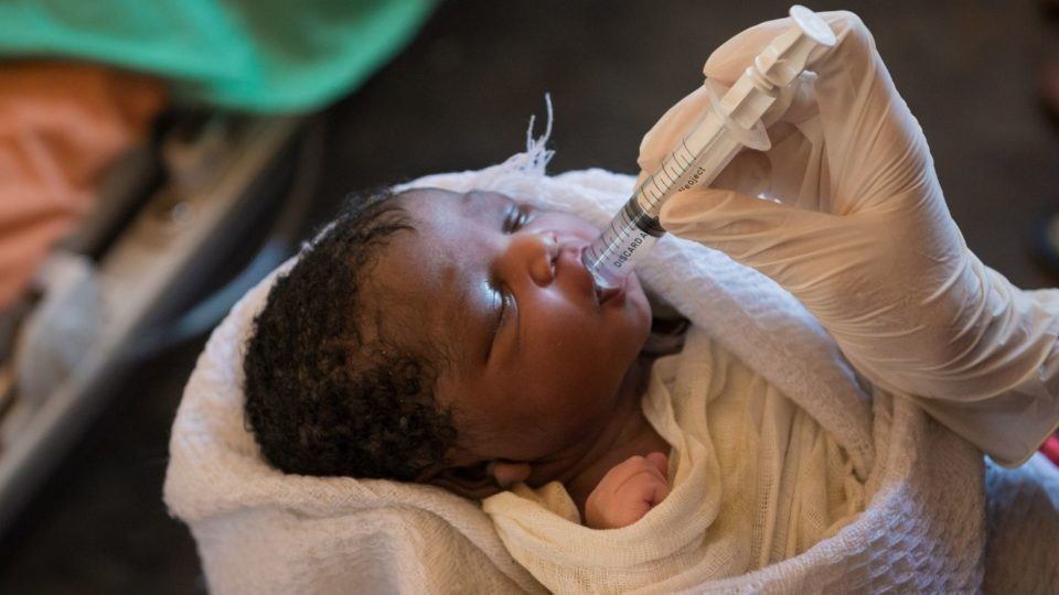 Volunteer Nurse Sarah Rubino holding child in South Sudan in October 2018.