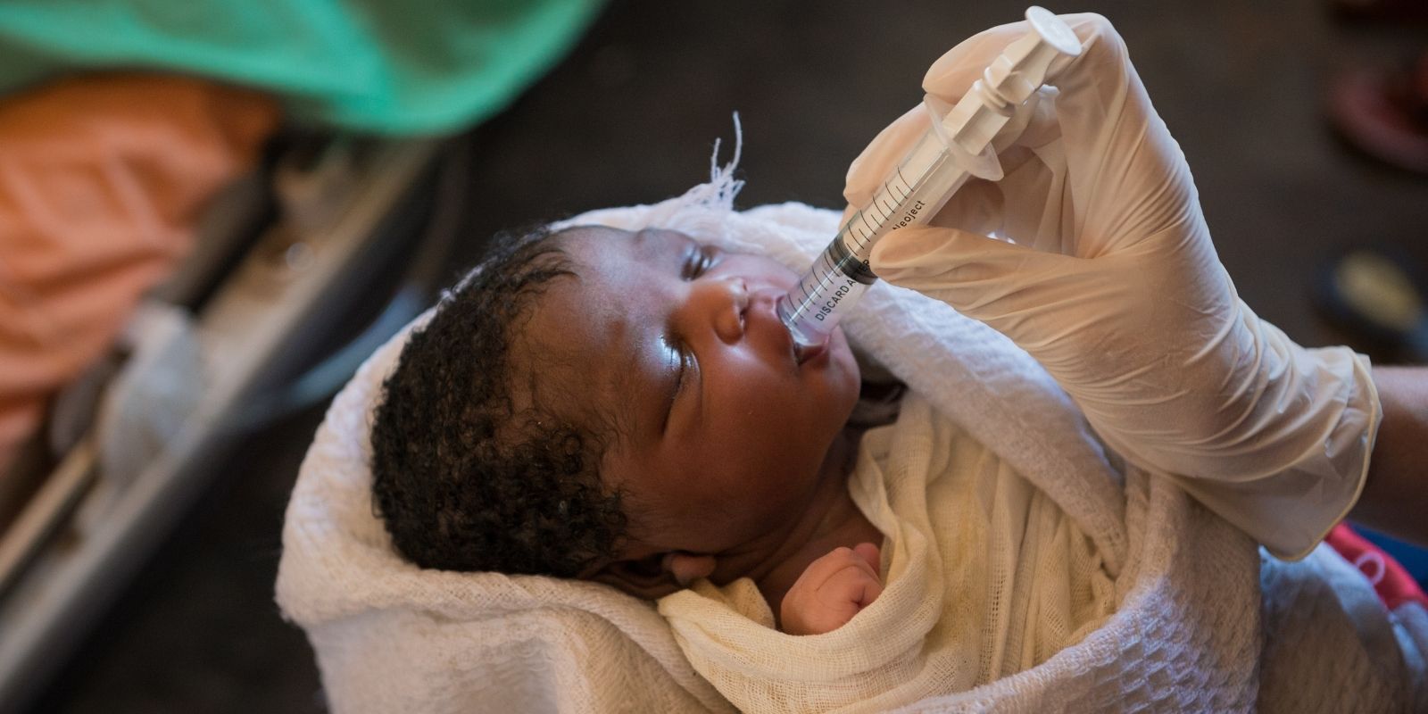 Volunteer Nurse Sarah Rubino holding child in South Sudan in October 2018.