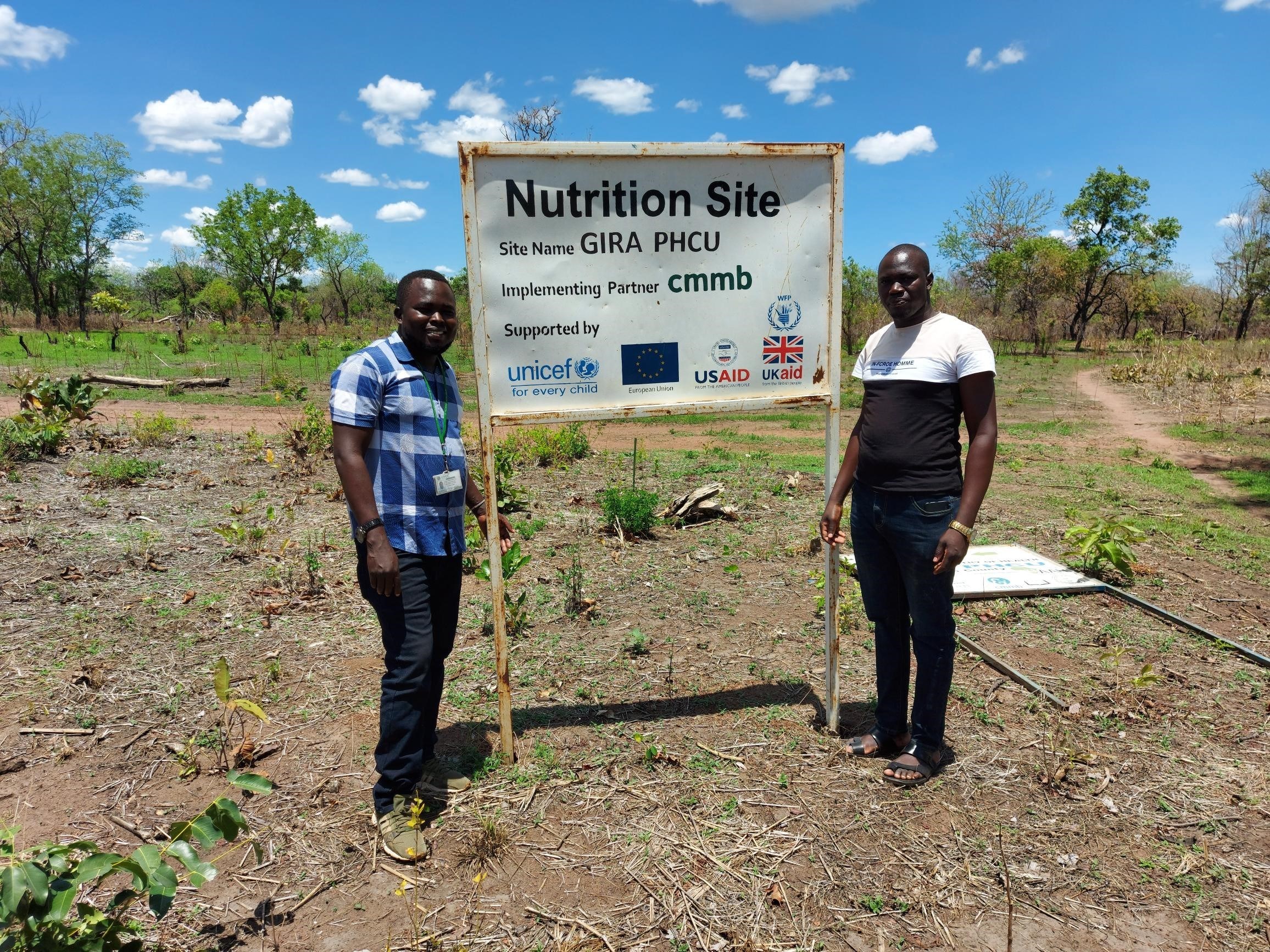 william and colleague in front of nutrition site