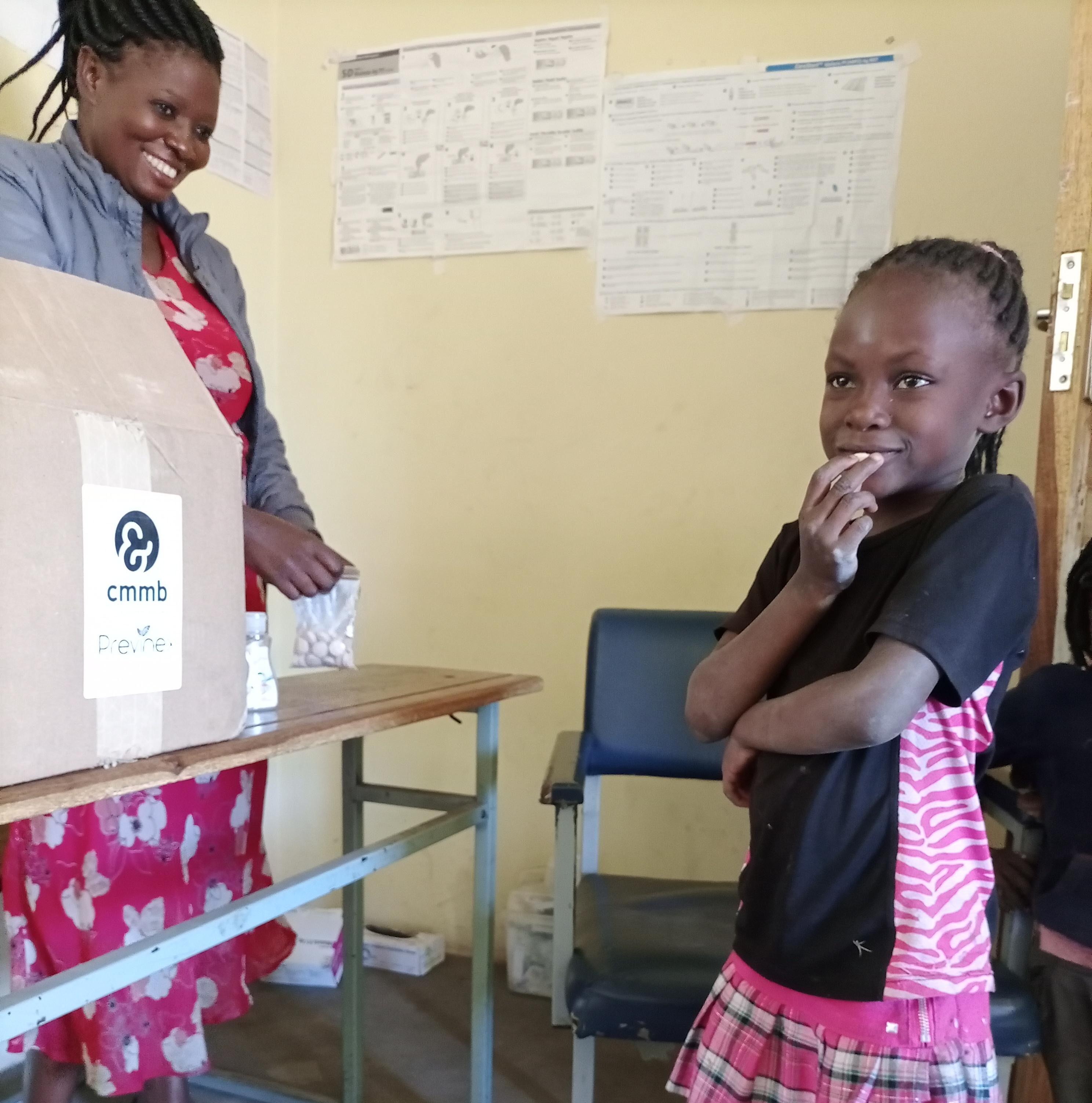 child in zambia taking multivitamin