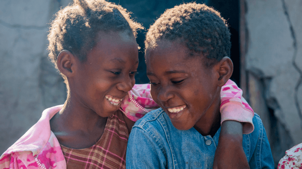 children laughing to each other zambia