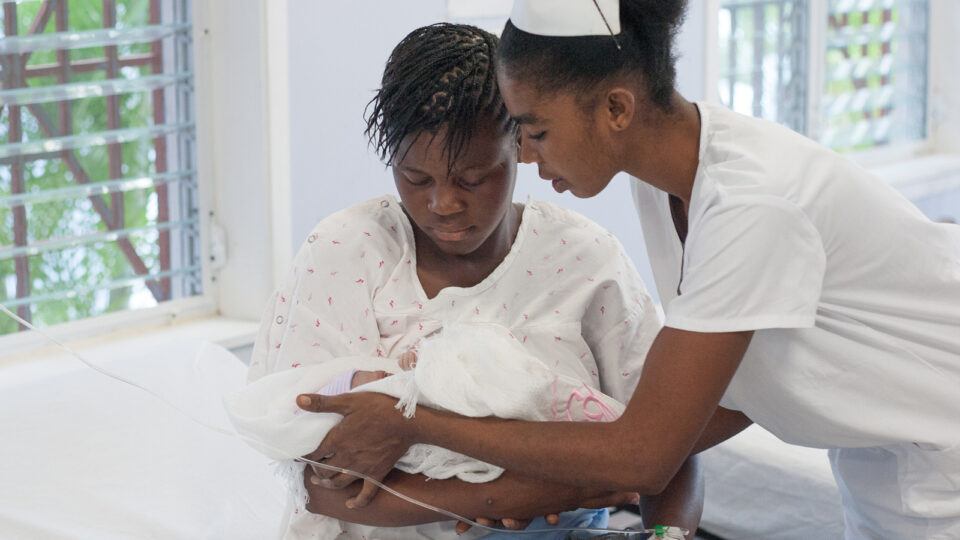 A mother and her newborn infant with a skilled birth attendant at Bishop Joseph Sullivan hospital in Cotes-de-Fer, Haiti.
