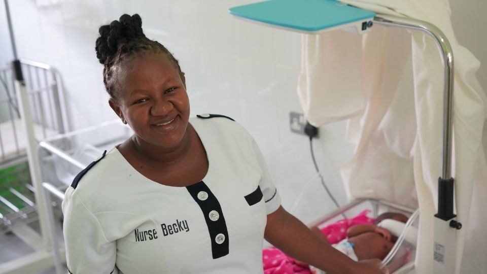 Nurse Becky with newborn in Kenya 2022