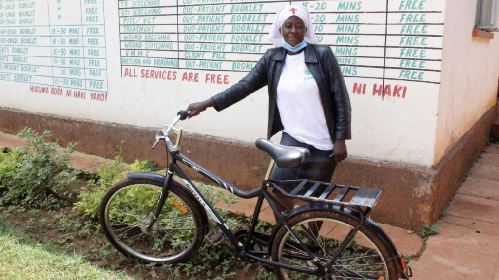A community health worker travels by bike to reach patients_June2022