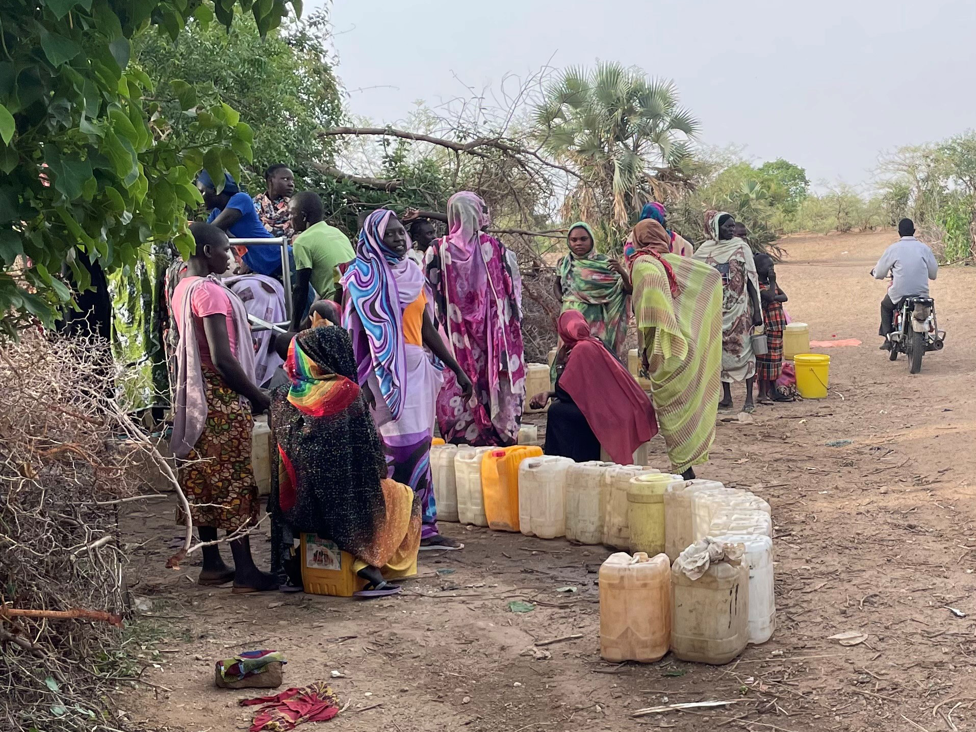 People gather at a water well in Sudan_sept2022