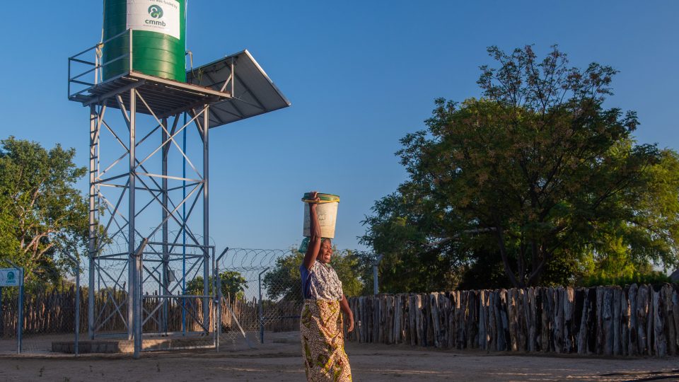 Precious carries water from Cmmb-funded borehole_Zambia2022